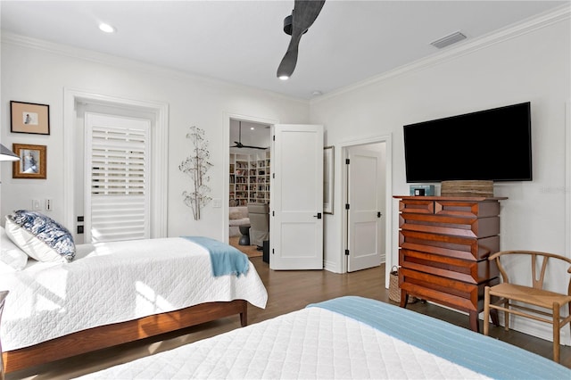 bedroom with connected bathroom, ceiling fan, ornamental molding, and dark hardwood / wood-style floors