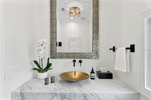 bathroom featuring vanity and crown molding