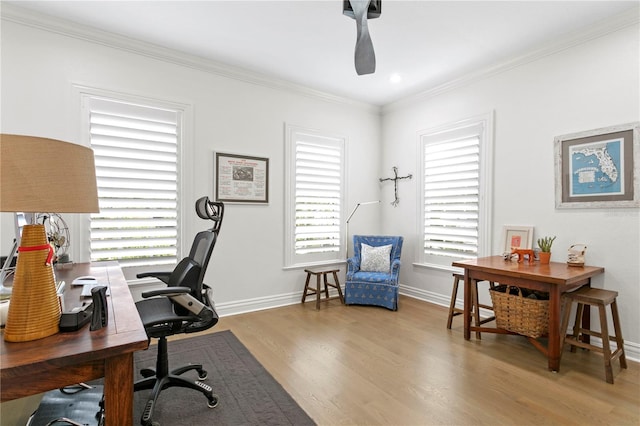 office area with ornamental molding and hardwood / wood-style floors