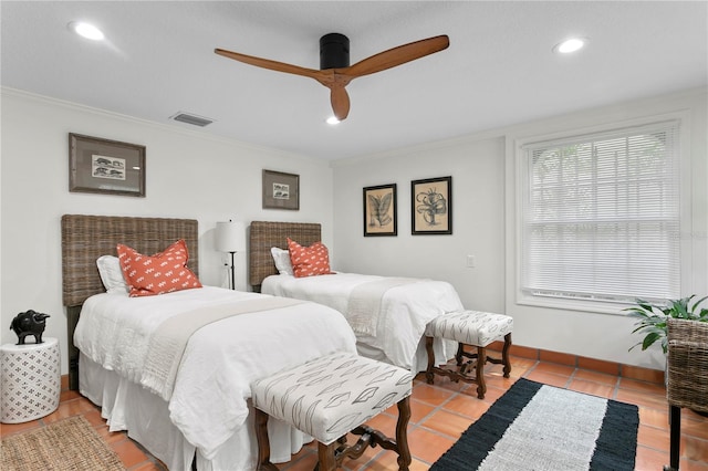 tiled bedroom featuring crown molding and ceiling fan