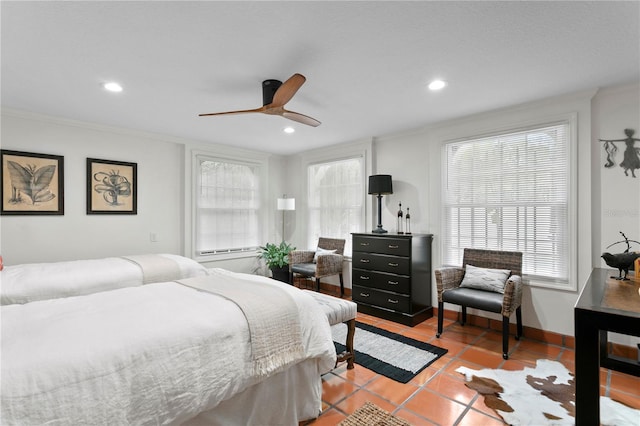 bedroom featuring ornamental molding, light tile patterned flooring, and ceiling fan