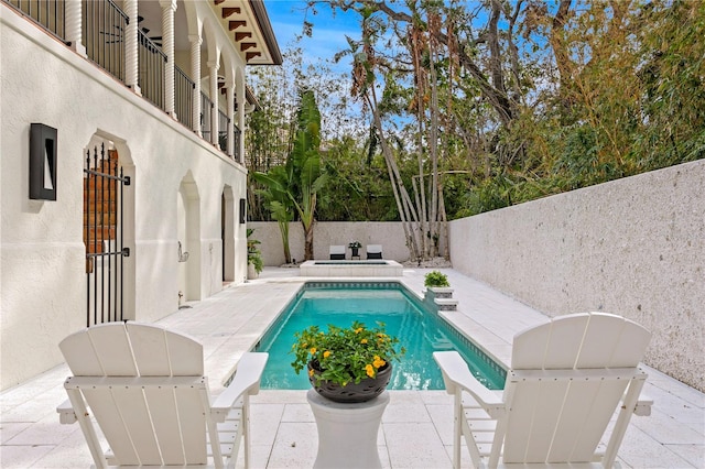 view of swimming pool featuring a patio area