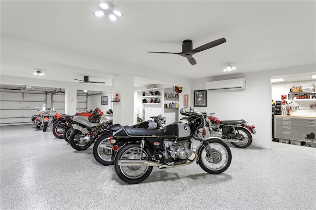 garage featuring a wall unit AC and ceiling fan