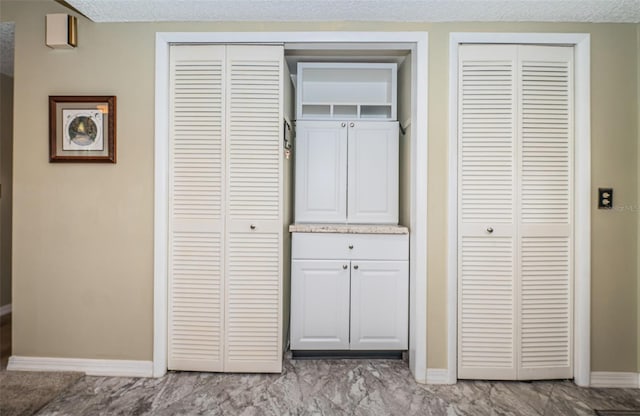 interior space featuring a textured ceiling