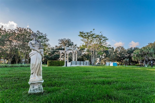 surrounding community featuring a lawn