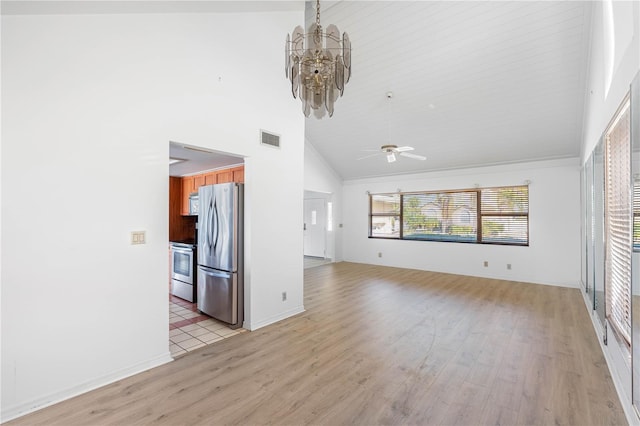 unfurnished living room featuring ceiling fan with notable chandelier, high vaulted ceiling, and light wood-type flooring