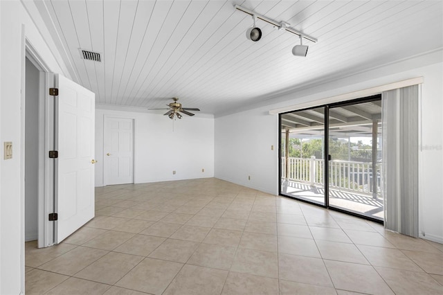 spare room featuring light tile patterned flooring, rail lighting, wooden ceiling, and ceiling fan