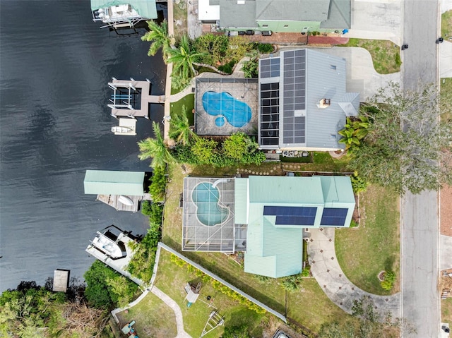 birds eye view of property with a water view