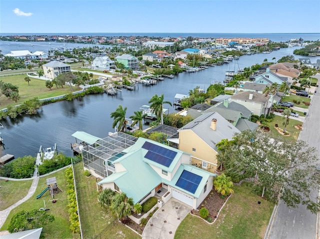 bird's eye view featuring a water view and a residential view