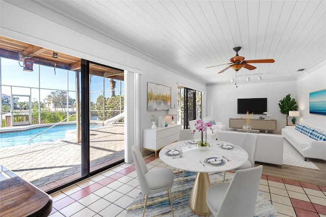 dining room with light tile patterned floors, ceiling fan, visible vents, and wood ceiling