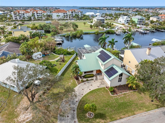 drone / aerial view with a water view and a residential view