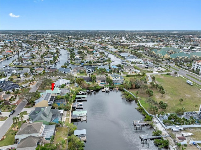 bird's eye view with a water view and a residential view