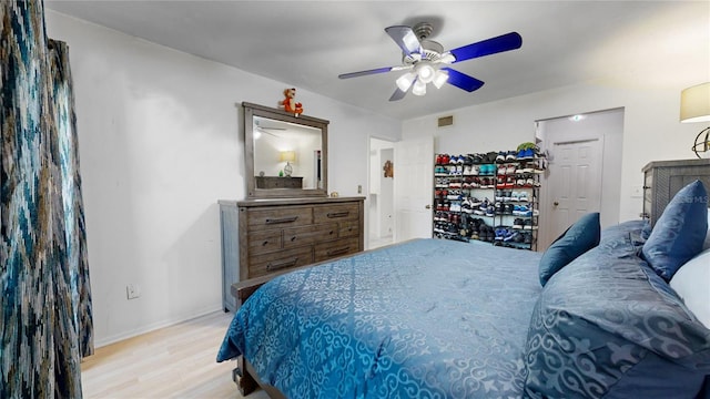 bedroom featuring light hardwood / wood-style floors and ceiling fan