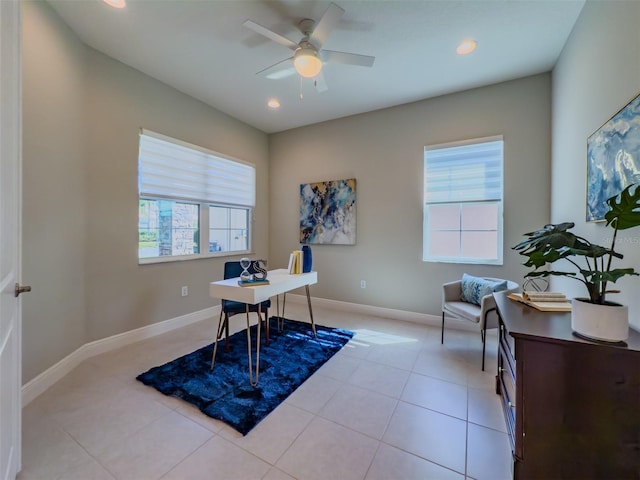 tiled office space featuring ceiling fan