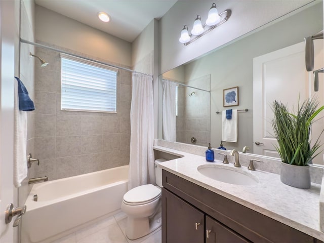 full bathroom featuring toilet, vanity, tile patterned floors, and shower / tub combo with curtain