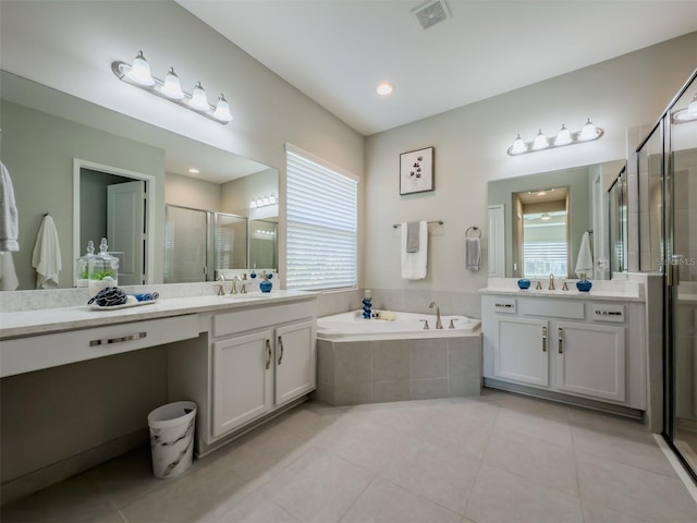 bathroom featuring vanity, tile patterned floors, and shower with separate bathtub