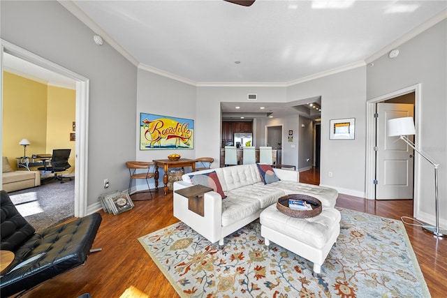 living room featuring hardwood / wood-style floors and ornamental molding