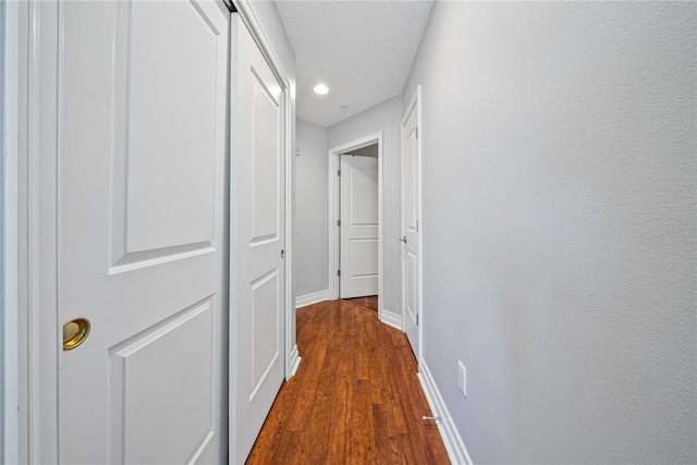 hall featuring dark wood-type flooring