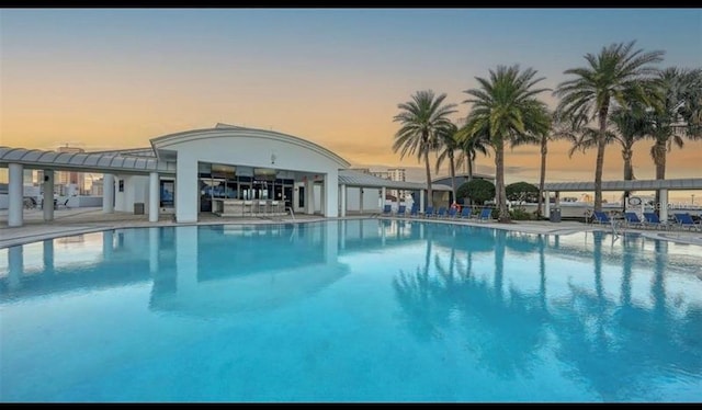 1209 E Cumberland Ave Unit 508, Tampa, FL 33602 - pool at dusk featuring a community pool and a patio area