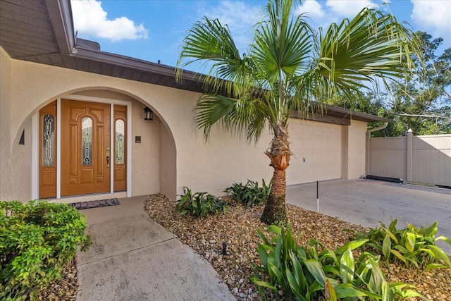 property entrance featuring a porch and a garage