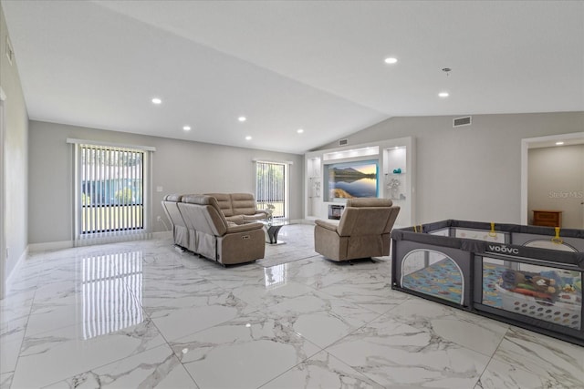 living room featuring vaulted ceiling