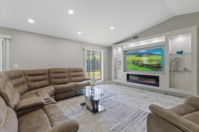 living room featuring vaulted ceiling