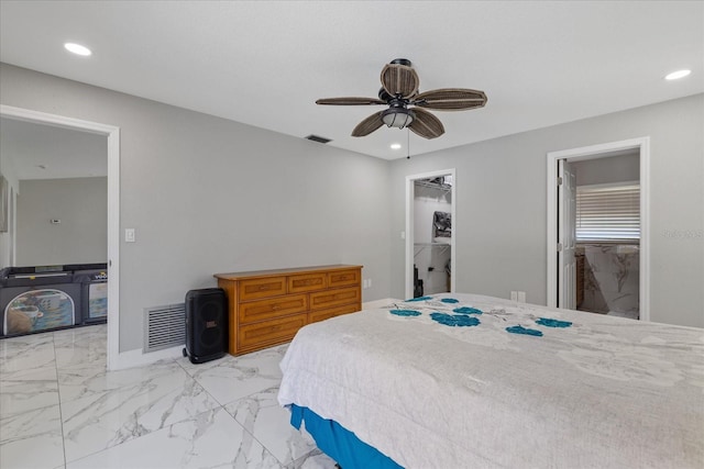 bedroom featuring a spacious closet, ceiling fan, and a closet