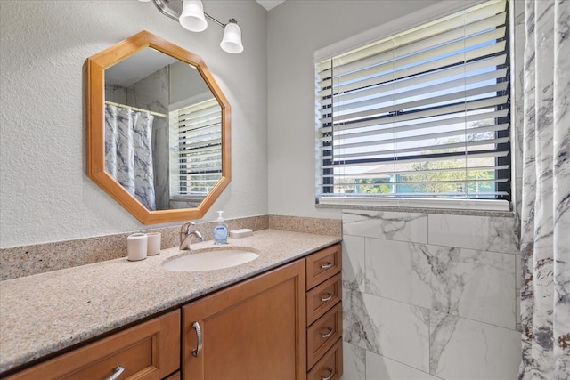 bathroom featuring vanity and a shower with curtain