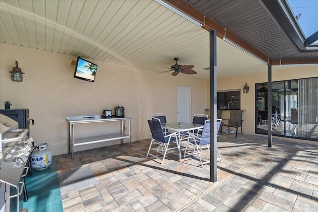 view of patio featuring ceiling fan