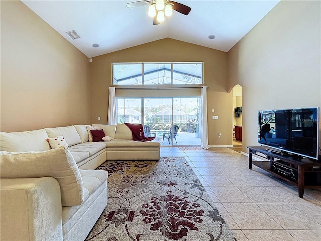 living room with ceiling fan, high vaulted ceiling, and light tile patterned floors