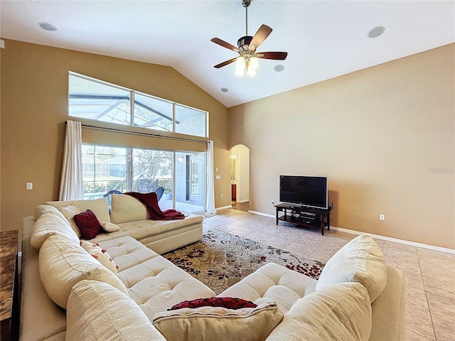 living room with light tile patterned floors, lofted ceiling, and ceiling fan