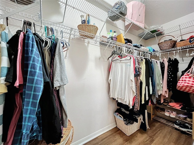 walk in closet featuring hardwood / wood-style floors