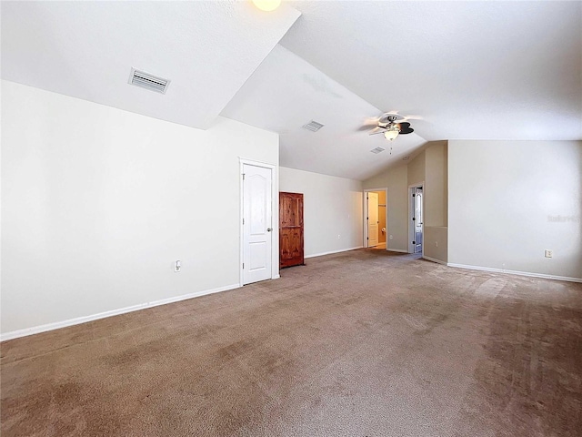 carpeted empty room with lofted ceiling and ceiling fan