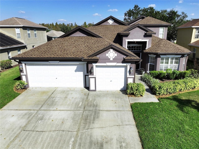 view of property featuring a front lawn