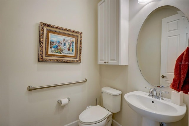 bathroom with sink and toilet