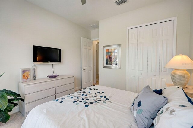 1804 Pacific Dunes Dr, Sun City Center, FL 33573 - bedroom with a closet, carpet, and a ceiling fan