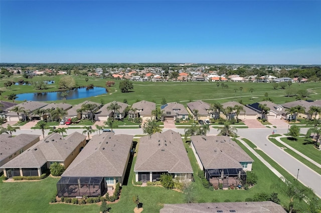 1804 Pacific Dunes Dr, Sun City Center, FL 33573 - aerial view of residential area with a large body of water and a local golf course