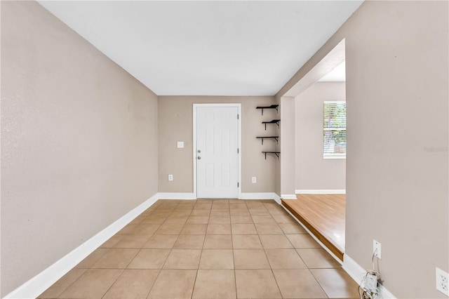 foyer featuring light tile patterned flooring