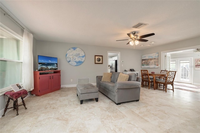 living room featuring ceiling fan