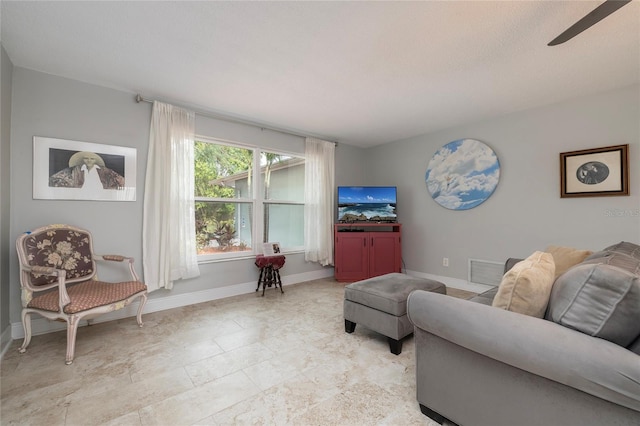 living room with ceiling fan