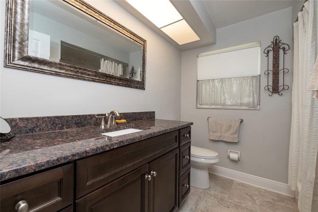 bathroom with toilet and vanity