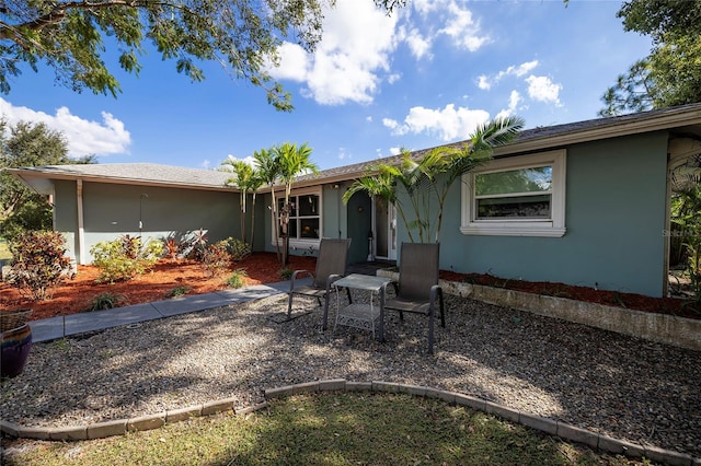 rear view of house featuring a patio