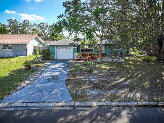 ranch-style home featuring a garage and a front yard