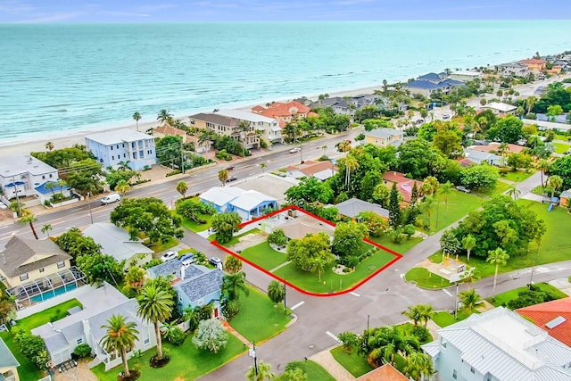 aerial view featuring a water view and a beach view