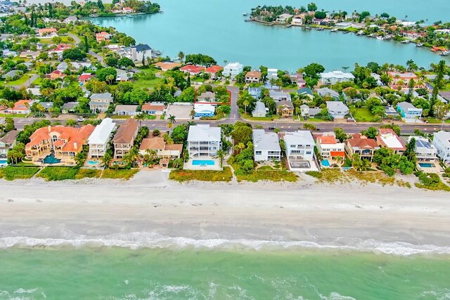 drone / aerial view featuring a water view and a view of the beach