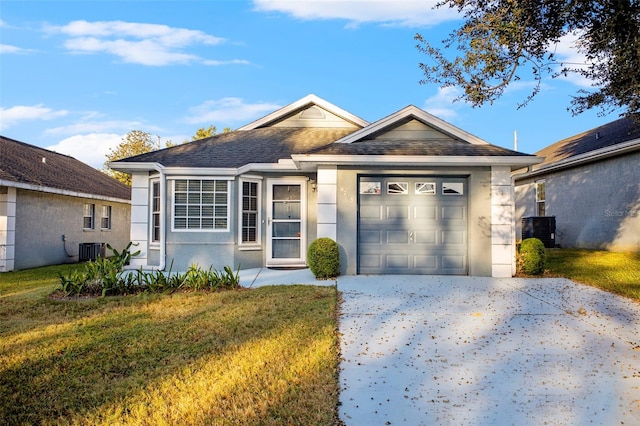 ranch-style house featuring concrete driveway, an attached garage, cooling unit, and a front yard