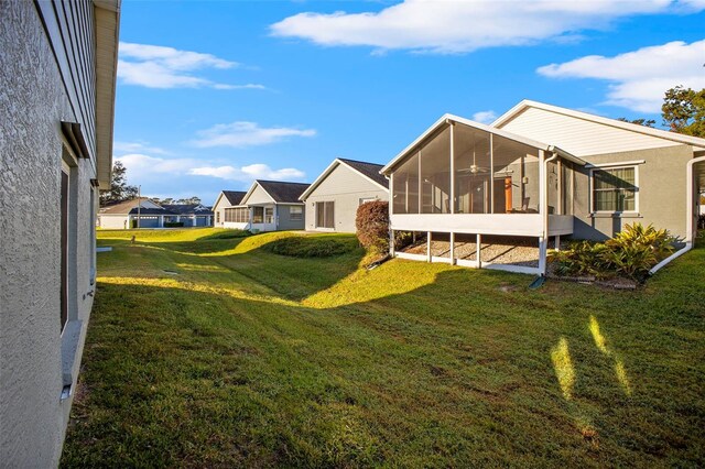 view of yard with a sunroom