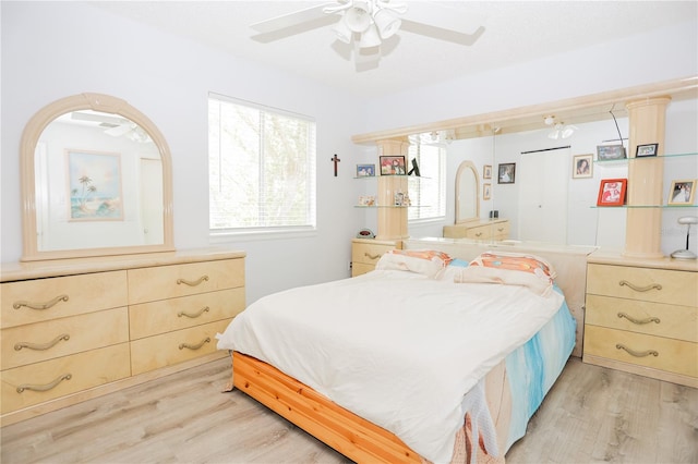 bedroom featuring light hardwood / wood-style flooring and ceiling fan