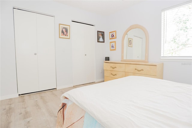 bedroom with light hardwood / wood-style floors