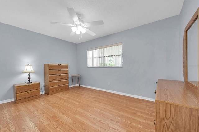 unfurnished bedroom featuring a closet, ceiling fan, and light hardwood / wood-style flooring